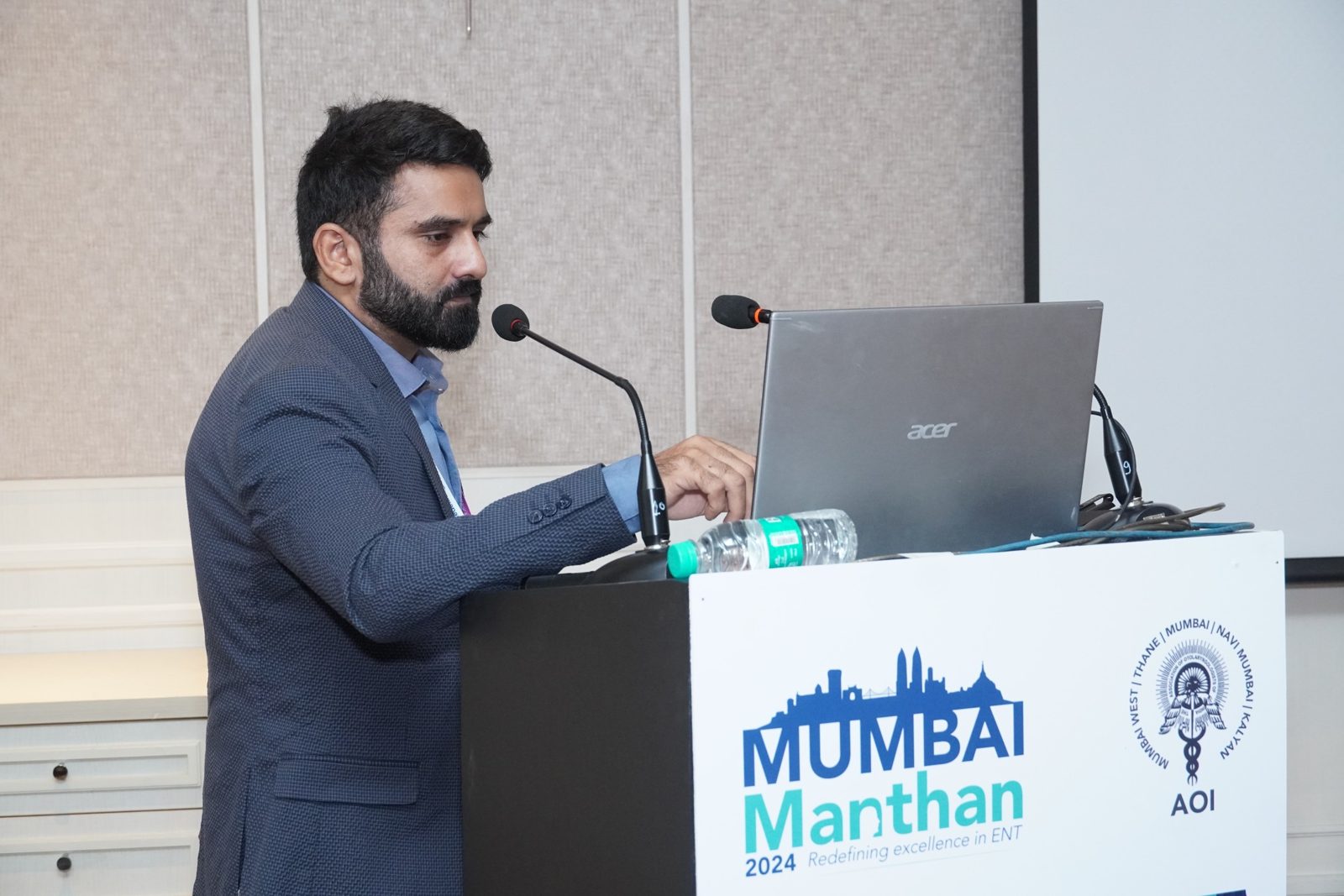 Dr Bhushan Kathuria presenting at a conference